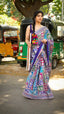 Elegant designer saree blooming with vibrant paisley charm and timeless festive vibes.