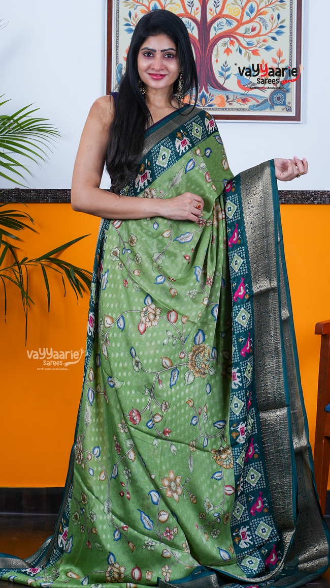 Green Dola Silk Saree with Kalamkari Art Prints | Premium Occasion Wear Saree | Vayyaarie Sarees Hover Image