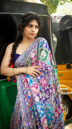 Elegant designer saree blooming with vibrant paisley charm and timeless festive vibes.