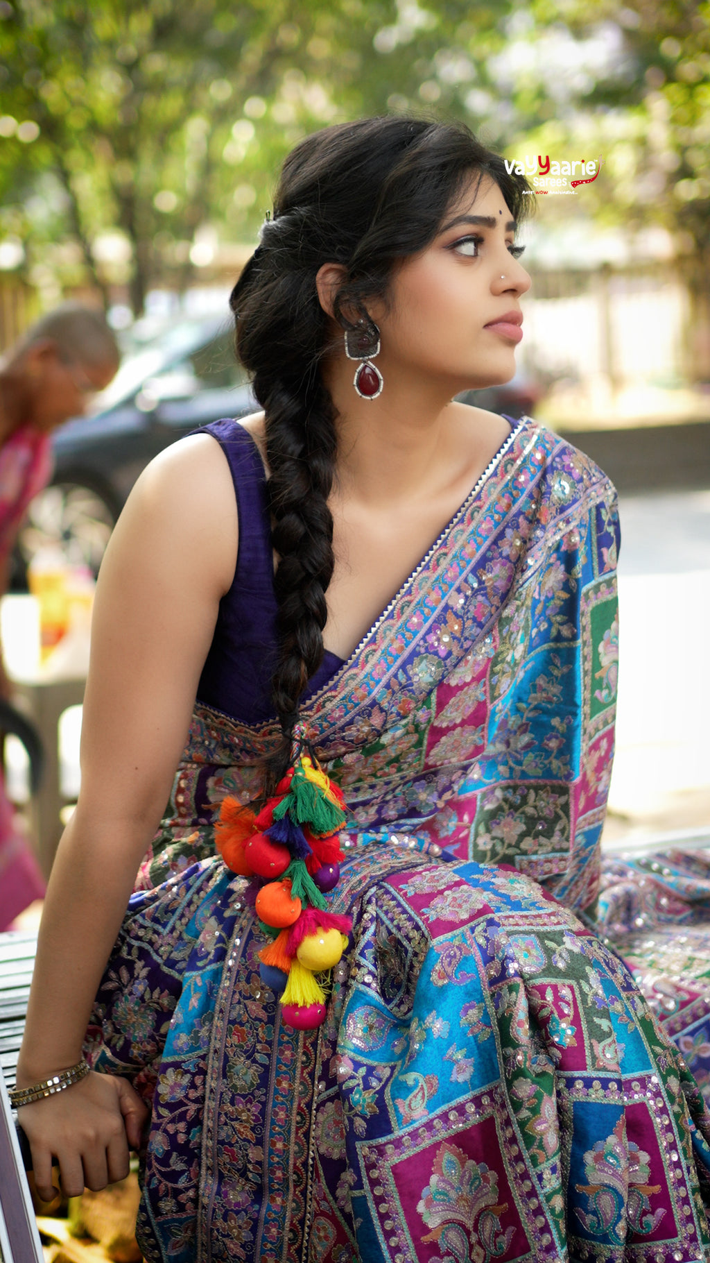 Elegant designer saree blooming with vibrant paisley charm and timeless festive vibes.